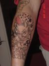 Evil tattoo on arm
